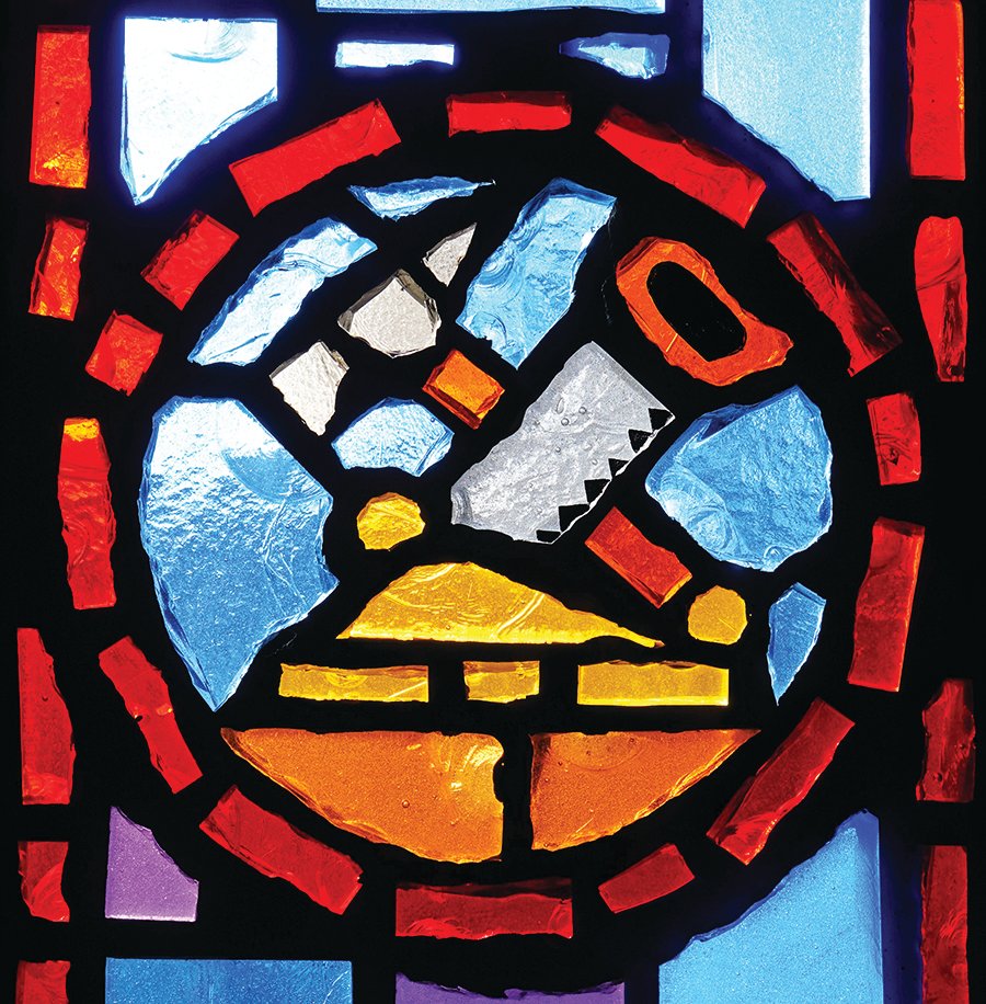Stained glass depicting symbols of St. Joseph, in St. Joseph Church in Pilot Grove.